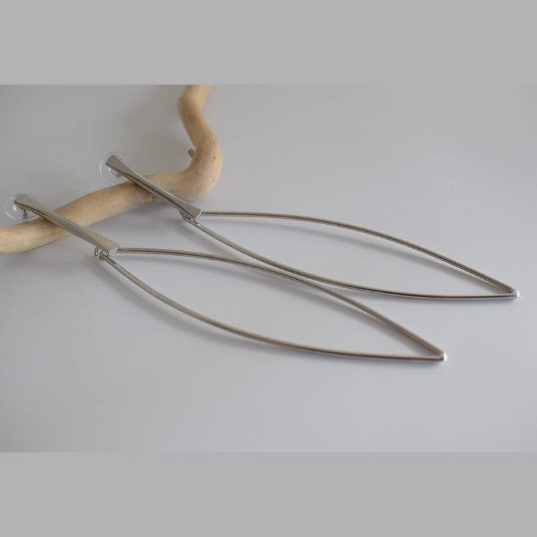 Nereis handmade Greek hammered long drop earrings with an open minimalist design, available in gold plated and silver plated.