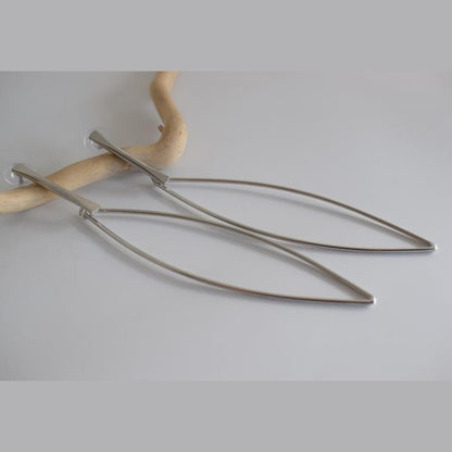 Nereis handmade Greek hammered long drop earrings with an open minimalist design, available in gold plated and silver plated.
