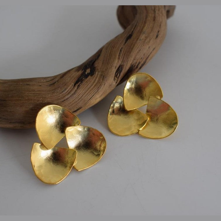 Hydor handmade Greek hammered earrings with layered organic forms, available in gold plated and silver plated.