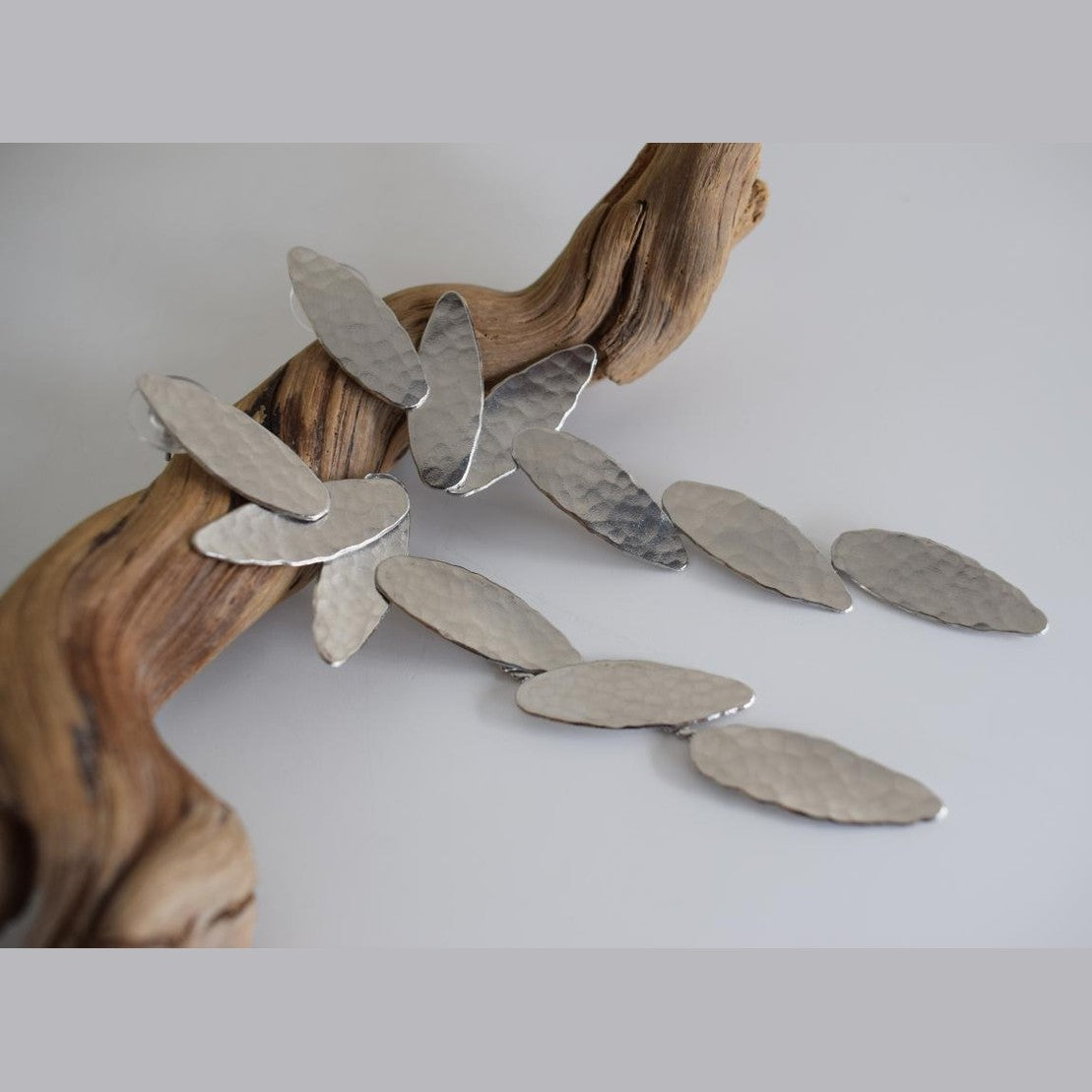 Nike2 handmade Greek hammered long drop earrings with wing-inspired forms, available in gold plated and silver plated.