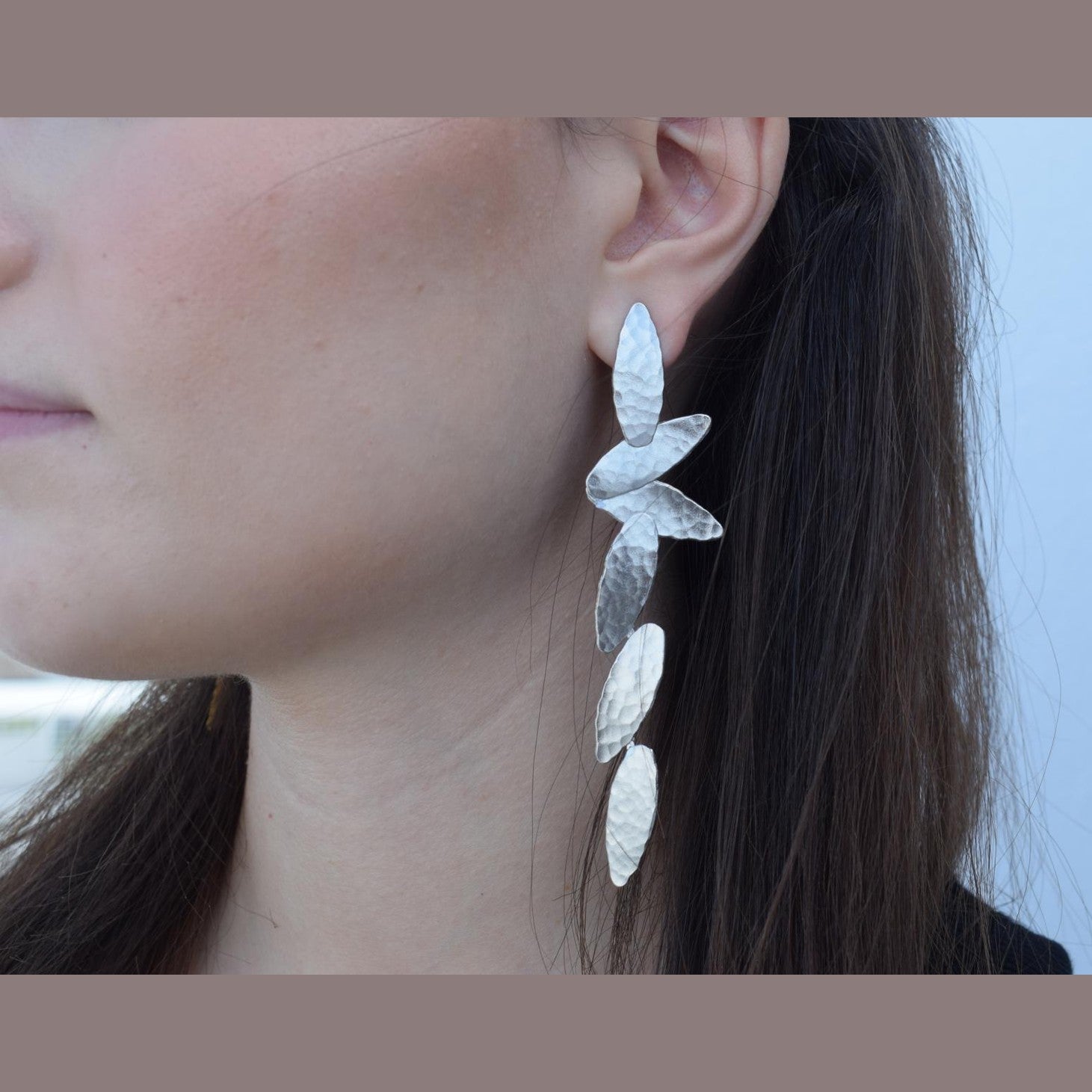 Nike2 handmade Greek hammered long drop earrings with wing-inspired forms, available in gold plated and silver plated.