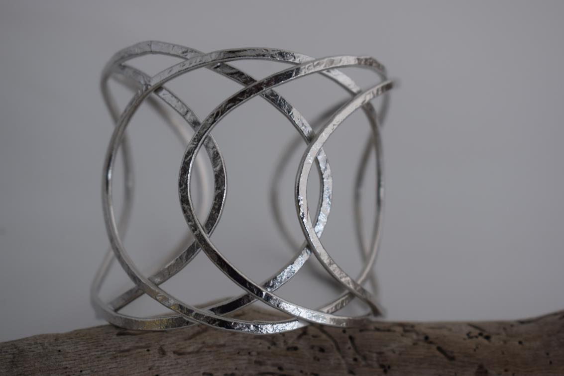 Thetis bracelet – Greek hammered jewelry with openwork wave-inspired design, available in 18K gold-plated, 18K silver-plated, and rose-gold plated finishes.