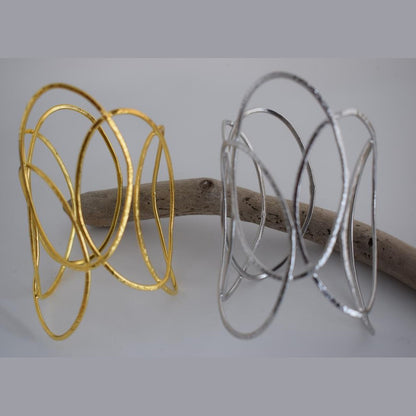 Elysia bracelet – Greek hammered jewelry with openwork interlaced design, available in 18K gold-plated, 18K silver-plated, and rose-gold plated finishes.