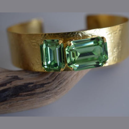 Electra bracelet – Greek hammered jewelry cuff with emerald-cut crystals, inspired by the radiant heroine Electra, available in 18K gold-plated, 18K silver-plated, and rose-gold plated finishes.