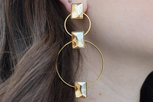 Ionio earrings with crystal – Greek hammered jewelry with hoops and faceted stones, inspired by the Ionian Sea, available in 18K gold-plated, 18K silver-plated, and rose-gold plated finishes.