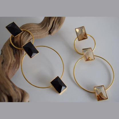 Ionio earrings with crystal – Greek hammered jewelry with hoops and faceted stones, inspired by the Ionian Sea, available in 18K gold-plated, 18K silver-plated, and rose-gold plated finishes.