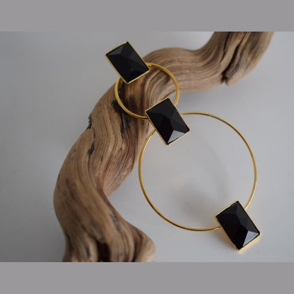 Ionio earrings with crystal – Greek hammered jewelry with hoops and faceted stones, inspired by the Ionian Sea, available in 18K gold-plated, 18K silver-plated, and rose-gold plated finishes.