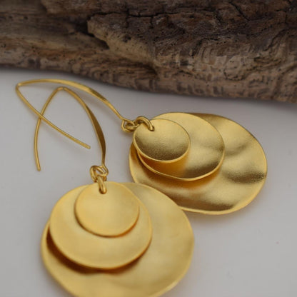 Selini earrings – Greek hammered jewelry with layered discs inspired by moon phases, available in 18K gold-plated, 18K silver-plated, and rose-gold plated finishes.