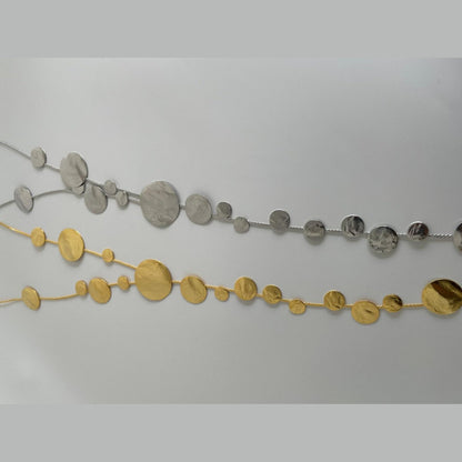 Ampelos necklace – Greek hammered jewelry with cascading hammered discs resembling grape clusters, available in 18K gold-plated, 18K silver-plated, and rose-gold plated finishes.