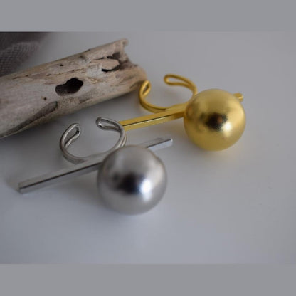 Sphairidio ring Greek hammered jewelry with sphere and bar geometric design, available in gold, silver, and rose gold plated.