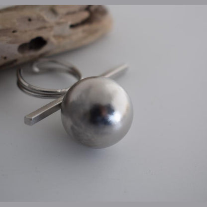 Sphairidio ring Greek hammered jewelry with sphere and bar geometric design, available in gold, silver, and rose gold plated.