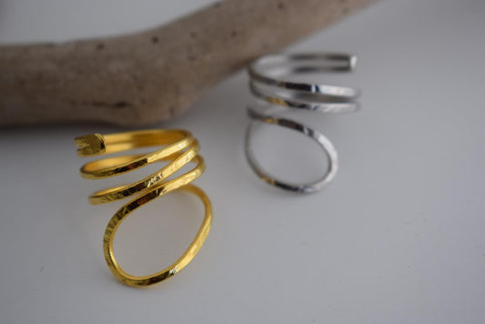 Ocean ring Greek hammered jewelry with spiral wave-inspired design, available in gold, silver, and rose gold plated.