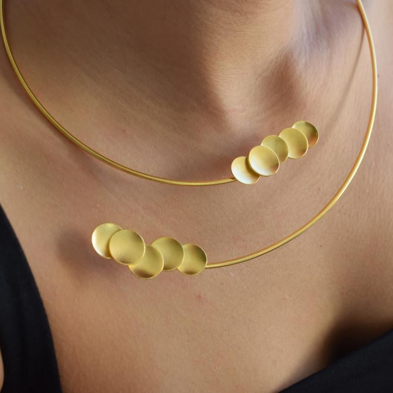 Mycenae necklace in Greek hammered disc design, worn as a minimalist choker and available in 18K gold plated and 18K silver plated finishes.