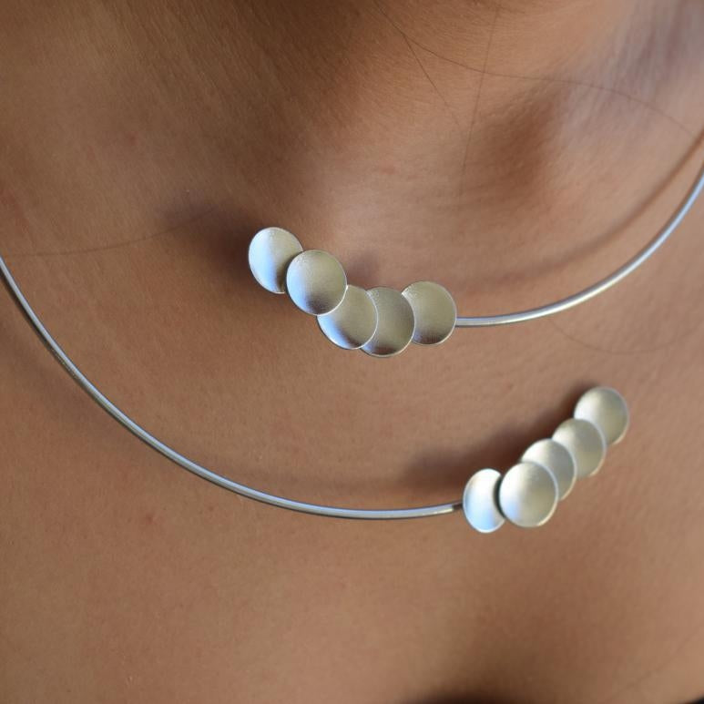 Mycenae necklace in Greek hammered disc design, worn as a minimalist choker and available in 18K gold plated and 18K silver plated finishes.