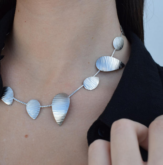 Noufaro Necklace – Handmade Greek hammered jewelry inspired by the sacred water lily, available in 18K gold or silver plated.