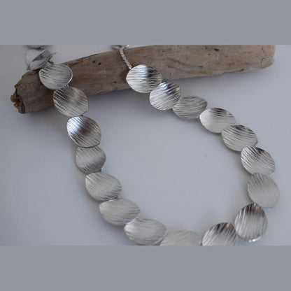 Nausicaa Necklace – Handmade Greek hammered jewelry with leaf design, available in 18K gold or silver plated finish.