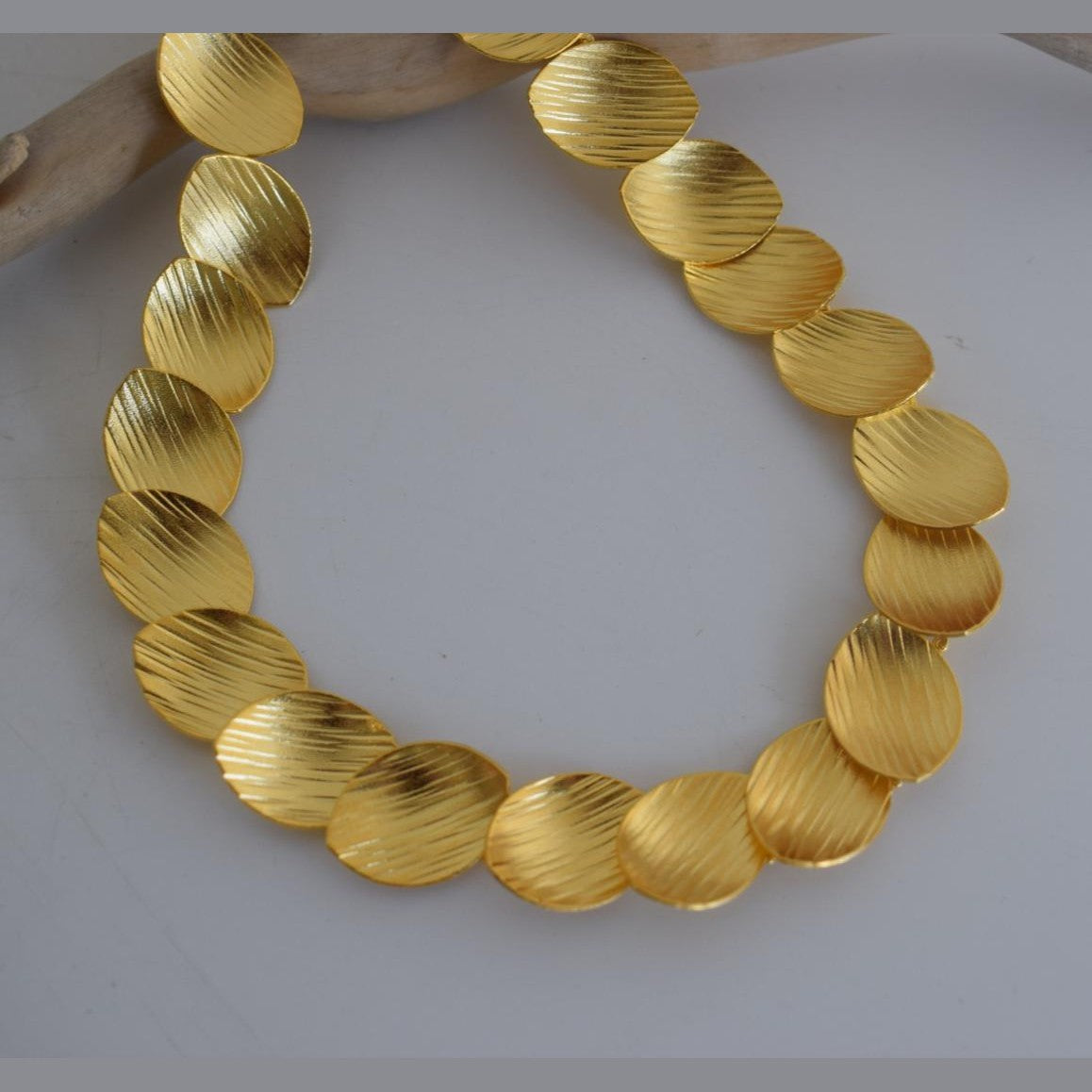 Nausicaa Necklace – Handmade Greek hammered jewelry with leaf design, available in 18K gold or silver plated finish.