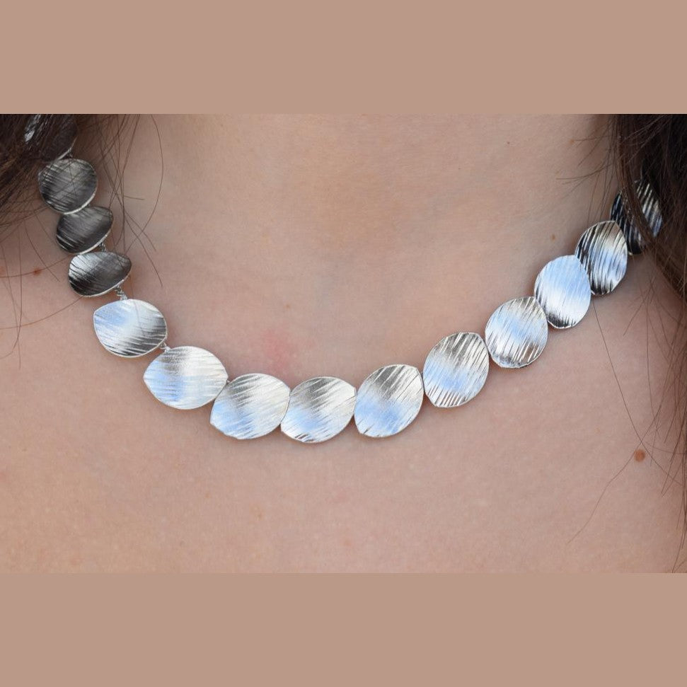 Nausicaa Necklace – Handmade Greek hammered jewelry with leaf design, available in 18K gold or silver plated finish.