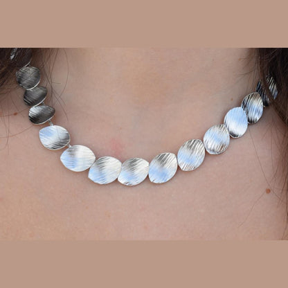 Nausicaa Necklace – Handmade Greek hammered jewelry with leaf design, available in 18K gold or silver plated finish.