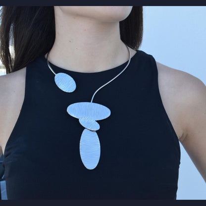 Nausicaa Necklace – Handmade Greek hammered jewelry inspired by the sea, available in 18K gold or silver plated finish.