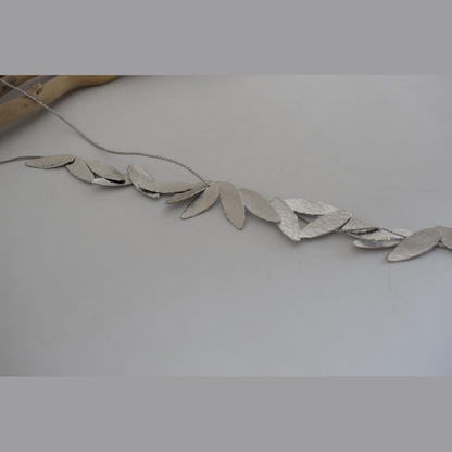 Nike Necklace – Handmade Greek hammered jewelry with golden leaf design, inspired by the goddess of victory, available in 18K gold or silver plated.