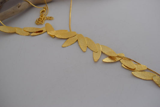 Nike Necklace – Handmade Greek hammered jewelry with golden leaf design, inspired by the goddess of victory, available in 18K gold or silver plated.