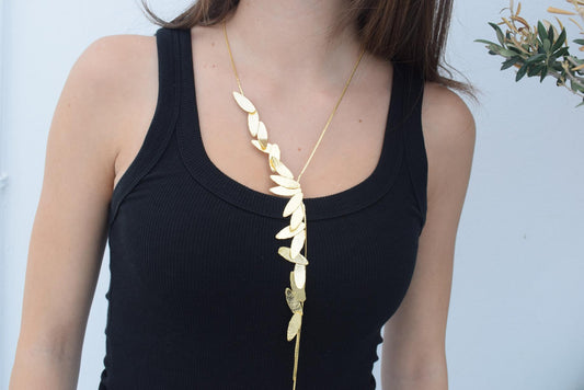 Nike Necklace – Handmade Greek hammered jewelry with golden leaf design, inspired by the goddess of victory, available in 18K gold or silver plated.