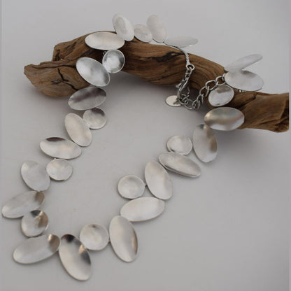Heliades Necklace – handmade Greek hammered jewelry inspired by the daughters of Helios, available in 18K gold and silver plated.