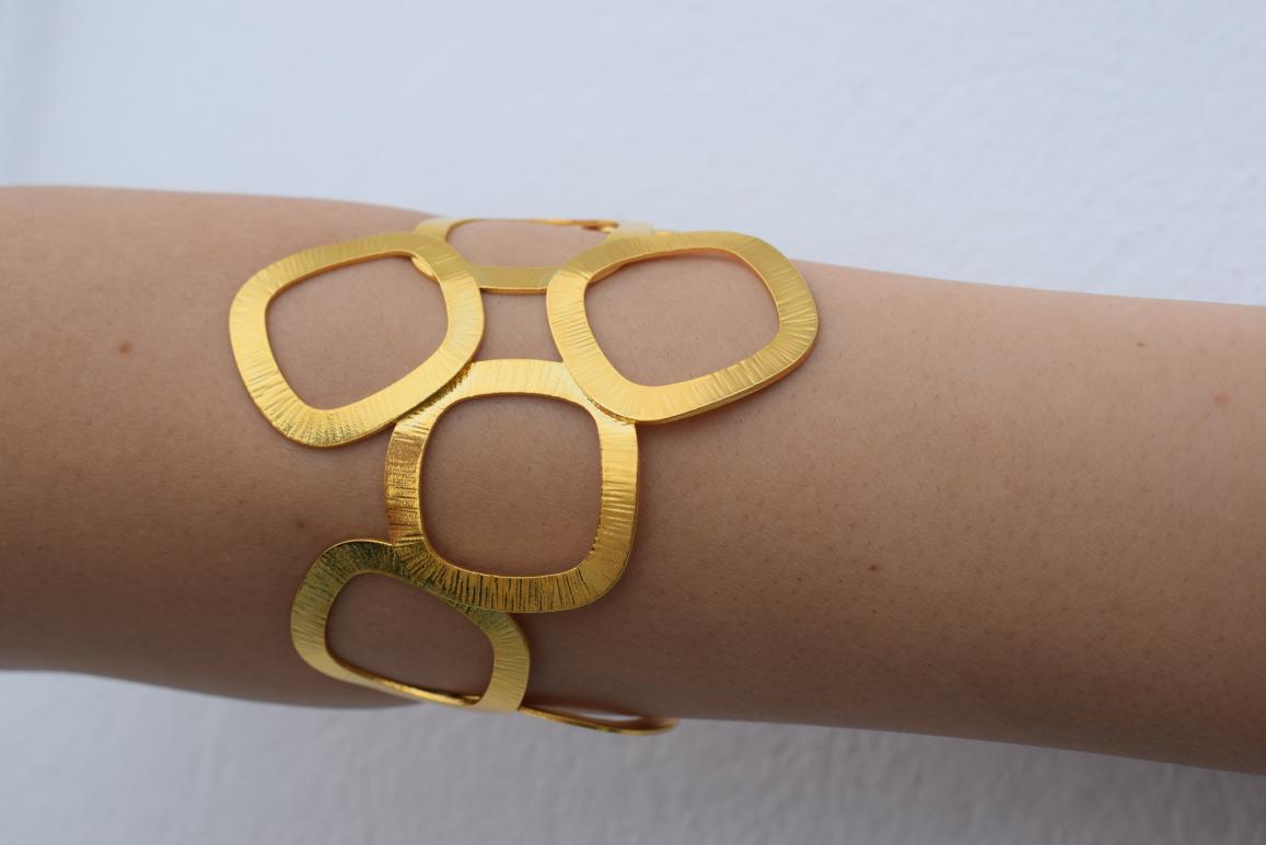 Kyklades Bracelet – handmade Greek hammered jewelry with openwork geometric design, available in 18K gold and silver plated.
