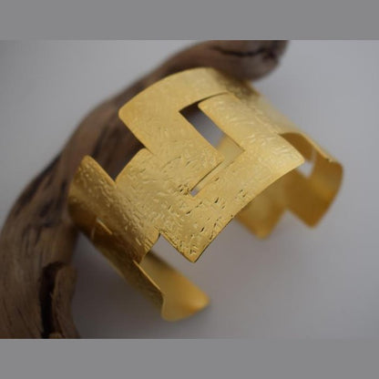 Labyrinthos Bracelet – handmade Greek hammered jewelry inspired by the ancient Labyrinth of Crete, available in 18K gold or silver plated.