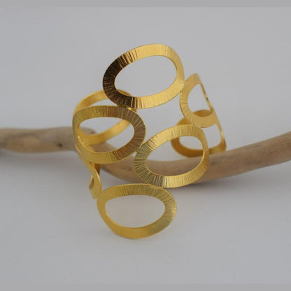 Handmade Rhodes bracelet, Greek hammered jewelry in 18K gold or silver plated with sculptural interlocking openwork design.