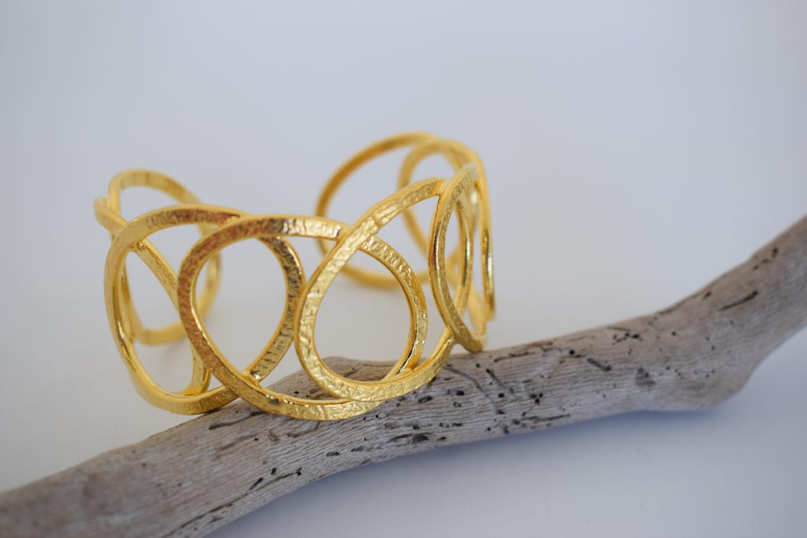 Handmade Hydor bracelet, Greek hammered jewelry in 18K gold or silver plated with flowing openwork sculptural design.