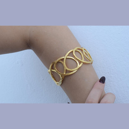 Handmade Hydor bracelet, Greek hammered jewelry in 18K gold or silver plated with flowing openwork sculptural design.