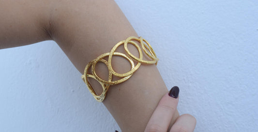 Handmade Hydor bracelet, Greek hammered jewelry in 18K gold or silver plated with flowing openwork sculptural design.
