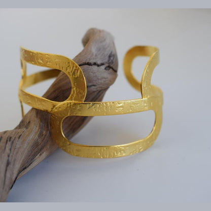 Handmade Galatea bracelet, Greek hammered jewelry available in 18K gold or silver plated with sculptural openwork design.