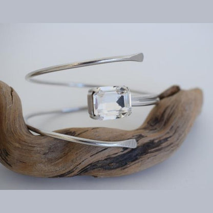 andmade Axon bracelet, Greek hammered jewelry in 18K gold or silver plated featuring a single crystal on a sculptural open cuff.