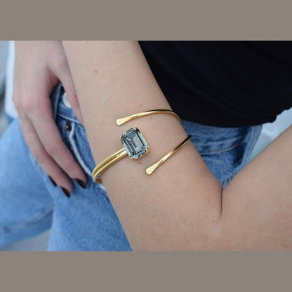 andmade Axon bracelet, Greek hammered jewelry in 18K gold or silver plated featuring a single crystal on a sculptural open cuff.