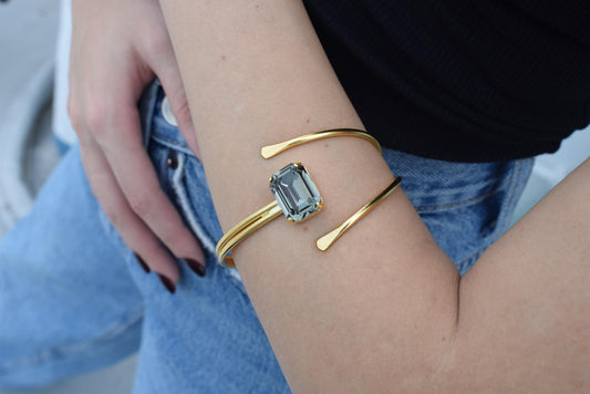 andmade Axon bracelet, Greek hammered jewelry in 18K gold or silver plated featuring a single Swarovski crystal on a sculptural open cuff.
