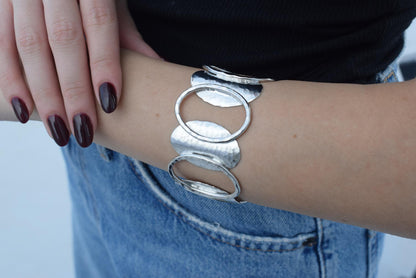 Handmade Andromeda bracelet, Greek hammered jewelry in 18K gold or silver plated with interlocking sculptural oval elements.