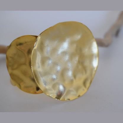 Echo bracelet, handmade Greek hammered jewelry with sculptural circular design, available in 18K gold or silver plated.