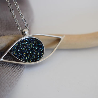Eye necklace with hammered eye design and stones. Greek hammered jewelry in 18K gold, silver 