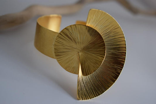 Kochlias bracelet Greek hammered jewelry spiral seashell design in 18K gold, silver, and rose gold plated finish.