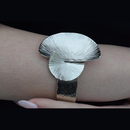 Kochlias bracelet Greek hammered jewelry spiral seashell design in 18K gold, silver, and rose gold plated finish.