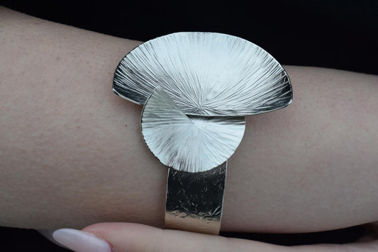 Kochlias bracelet Greek hammered jewelry spiral seashell design in 18K gold, silver, and rose gold plated finish.