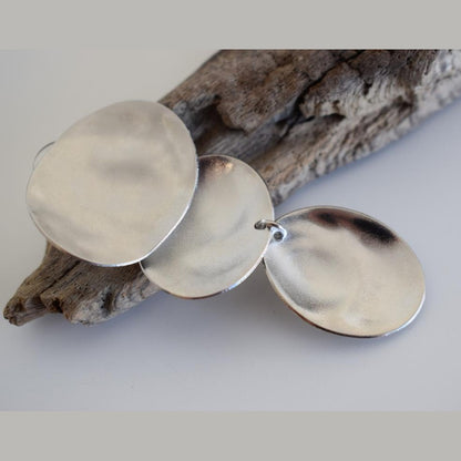 Heliades earrings in handmade Greek hammered jewelry design, available in 18K gold plated and 18K silver plated.