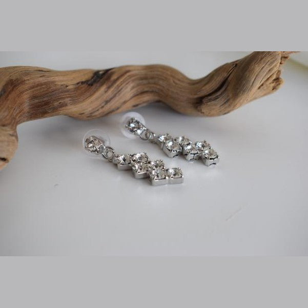 Asteria Earrings handmade Greek hammered jewelry with Fine crystals in a linear drop design, available in 18K gold plated and silver plated.