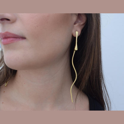 Delphi3 earrings in handmade Greek hammered jewelry, shown in a long organic design and available in 18K gold plated and silver plated finishes.