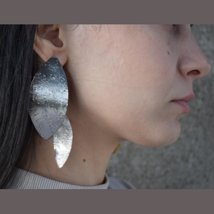 Nymphe Earrings – Greek Hammered Jewelry – Available in 18K Gold, Silver, and Rose Gold Plated. Handmade elongated hammered leaf-inspired design, symbolizing the grace of ancient nymphs.