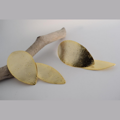 Nymphe Earrings – Greek Hammered Jewelry – Available in 18K Gold, Silver, and Rose Gold Plated. Handmade elongated hammered leaf-inspired design, symbolizing the grace of ancient nymphs.