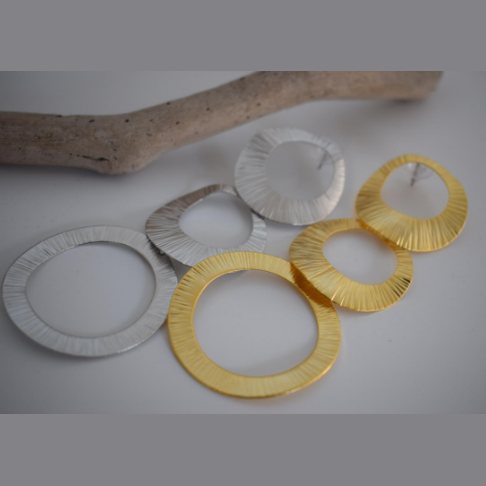 Kyklades Earrings – Greek Hammered Jewelry – Available in 18K Gold, Silver, and Rose Gold Plated. Handmade cascading hammered circles inspired by the Cycladic islands and Aegean heritage.